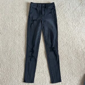 Distressed black skinny jeans